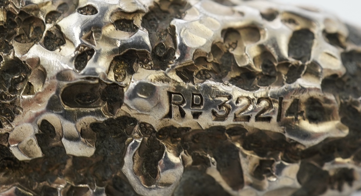 A late Victorian novelty silver scent flask, modelled as a 'gold nugget' by George Ward